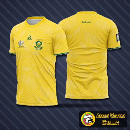 Imagem de uma camisa com design moderno mostrando um logo no peito e uma estampa grande nas costas, representando o conceito esportivo da seleção da África do Sul para 2026
